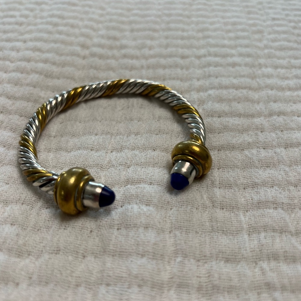 Sterling silver and brass cuff bracelet teller with indigo blue stone.